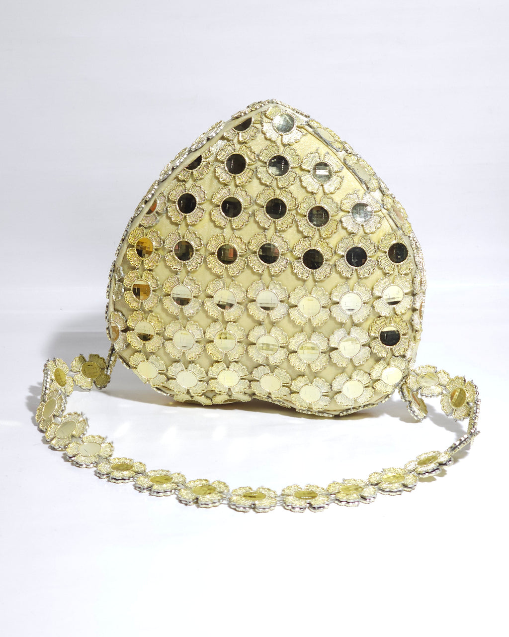 Gold sequin clutch bag on a white background